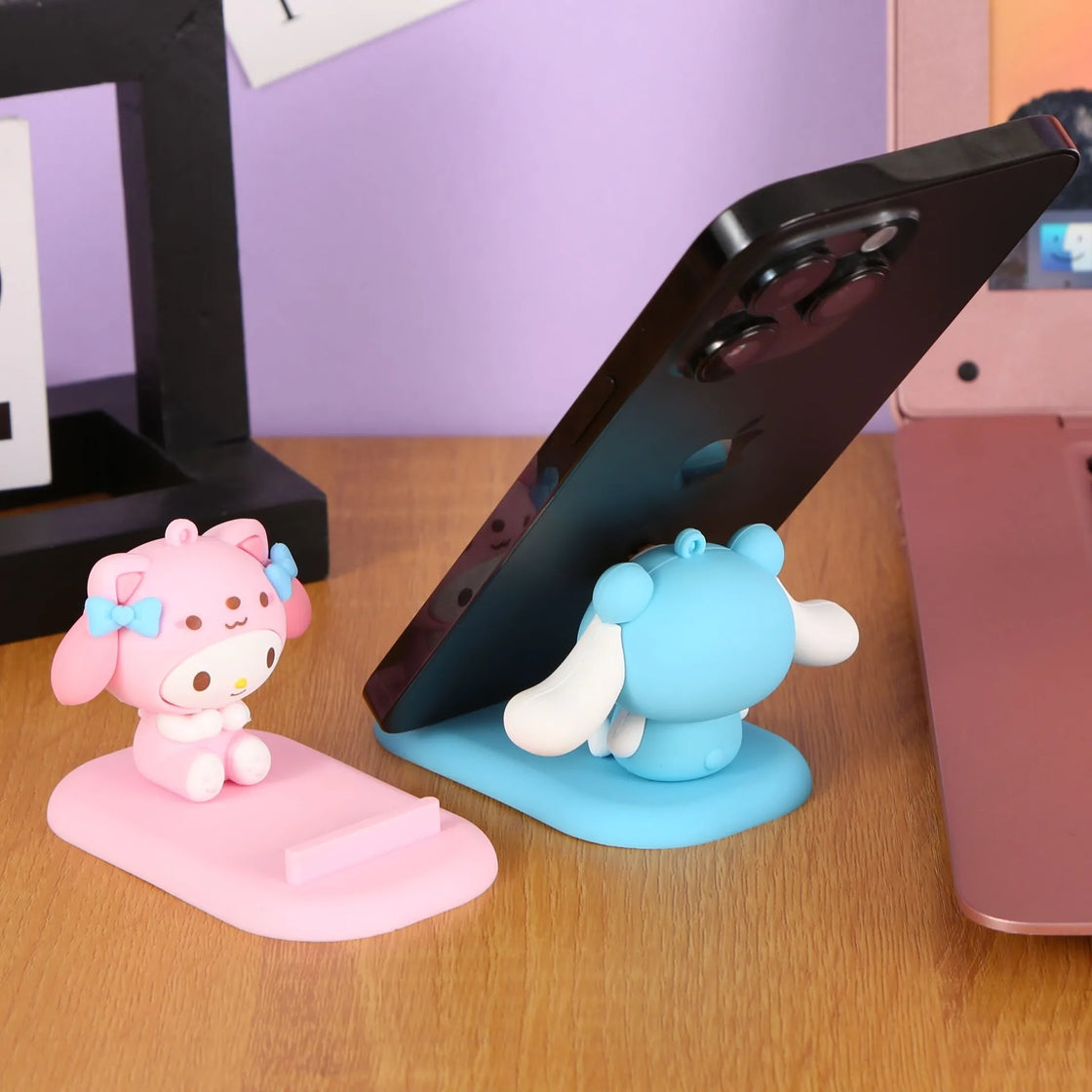 Charming Hello Kitty phone holder showcasing the iconic Sanrio character, perfect for anime-themed desk decor.