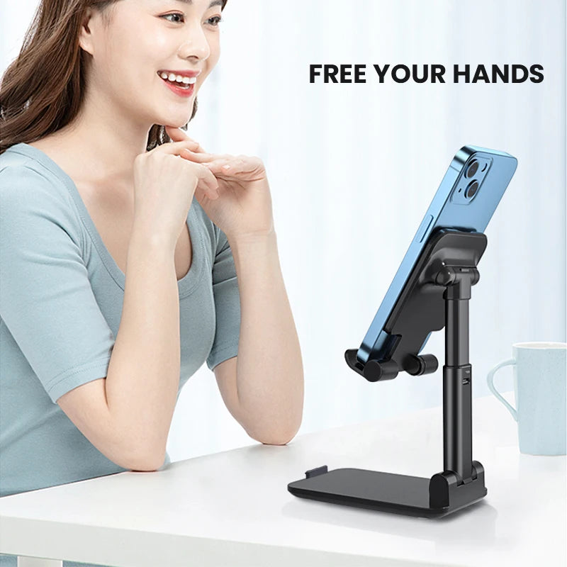 Adjustable Universal Desktop Phone Holder Stand with smartphone and charger access.