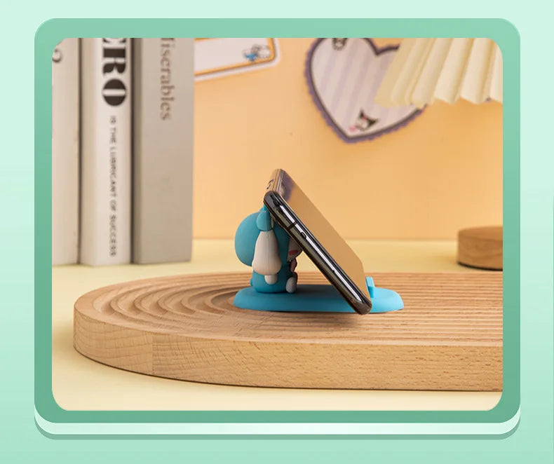 Charming Hello Kitty desk decor with a phone holder, adding a fun touch to your work area.