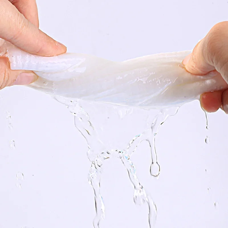 Compact 100PCS Mini Compressed Towel Capsules ideal for travel and face care - Features compressed tissue tablets for quick use.