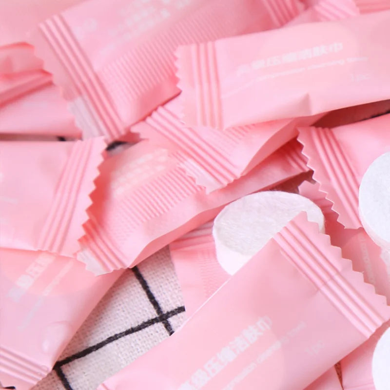 Essential 100PCS Mini Compressed Towel Capsules for travel support - Made of compressed tissue tablets for easy use.
