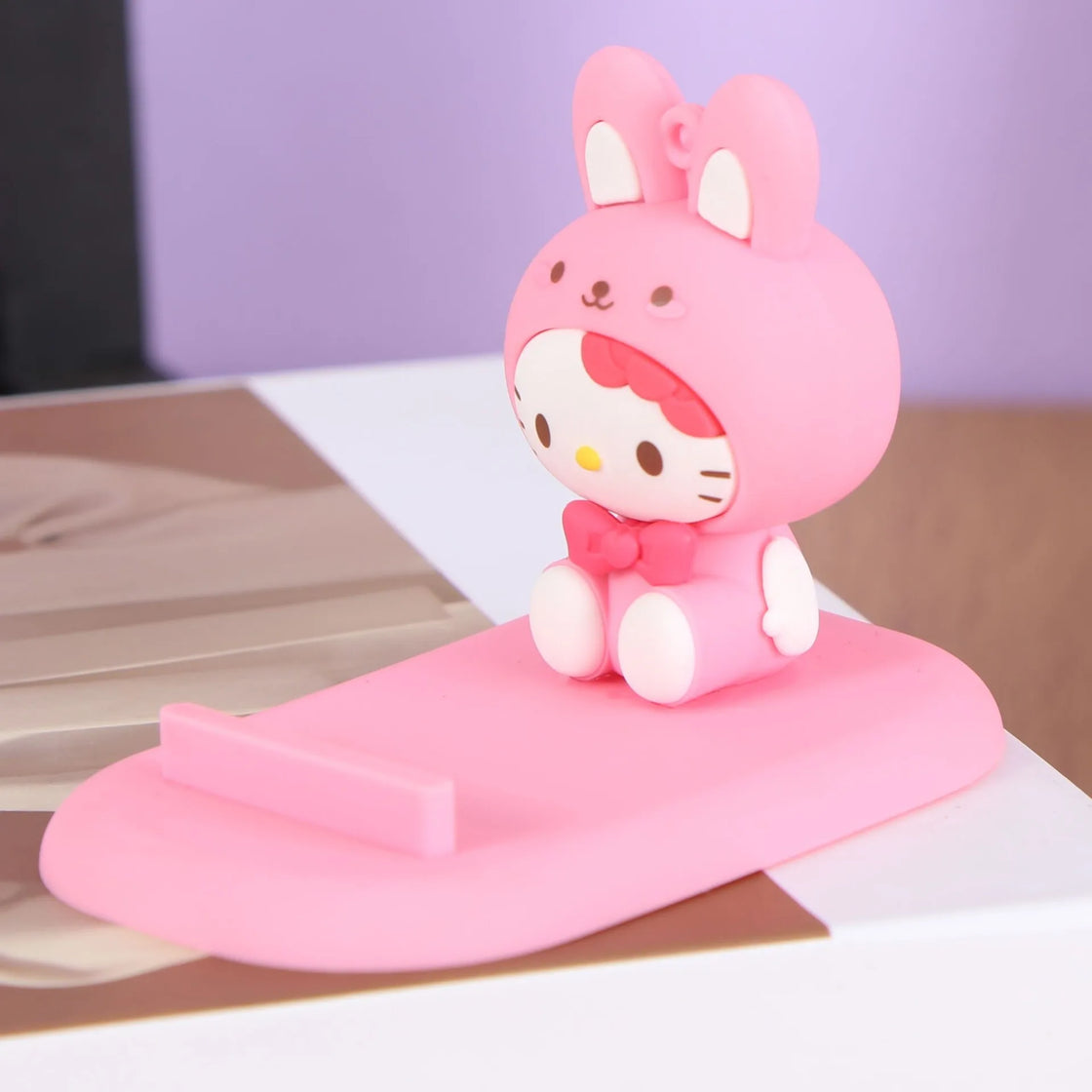 That's another adorable Hello Kitty phone holder, perfect for those looking for a touch of charm on their desk.