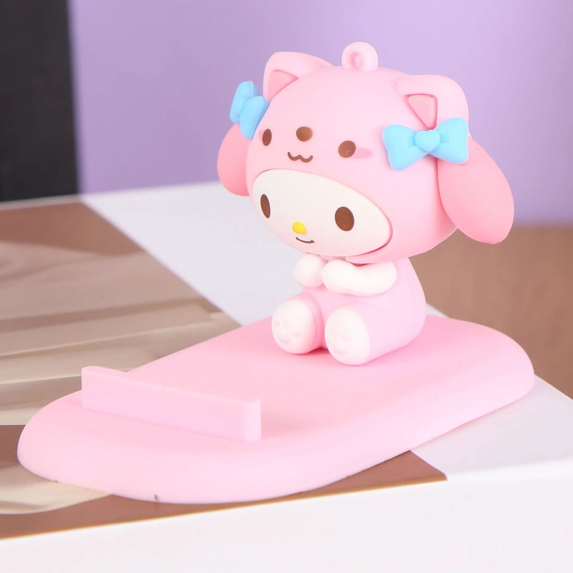Endearing Hello Kitty phone holder designed for both functionality and cute aesthetic in your office.