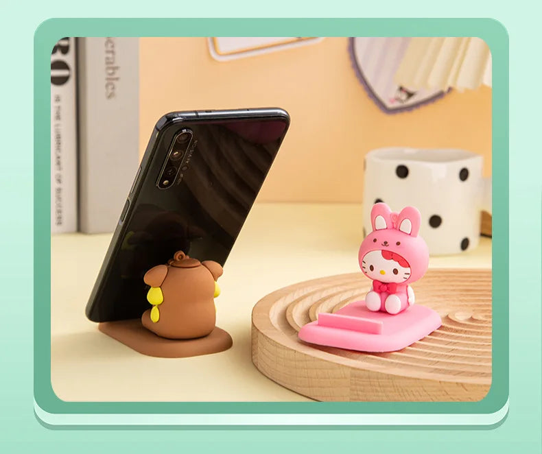 Functional and cute Hello Kitty phone holder, ideal for anime lovers looking to spruce up their desk.